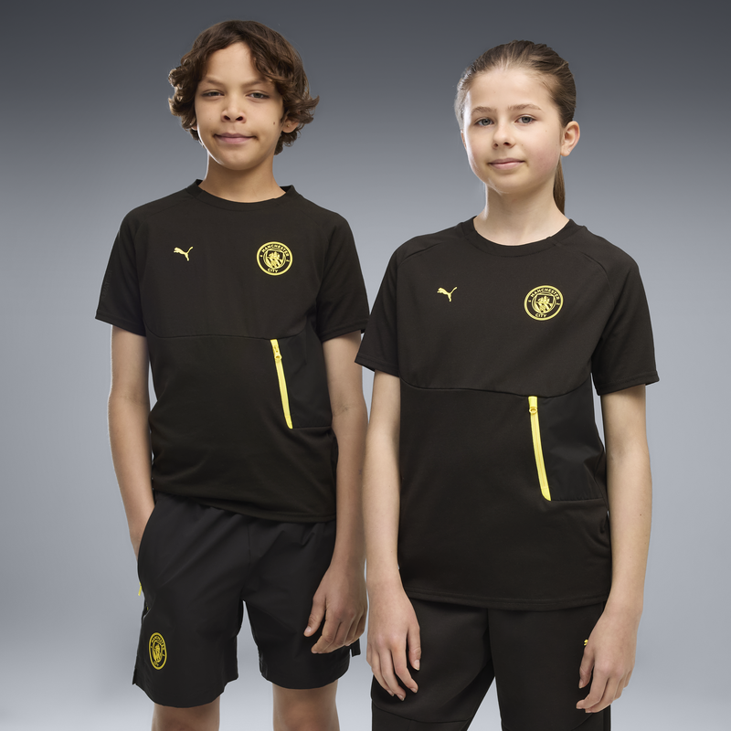 MCFC LW KIDS PUMATECH POCKET TEE - PUMA Black-Yellow Blaze